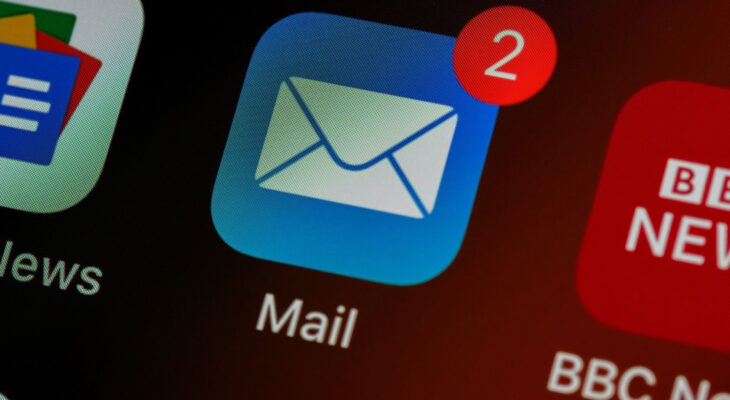 A phone screen shows a mail application with two notifications