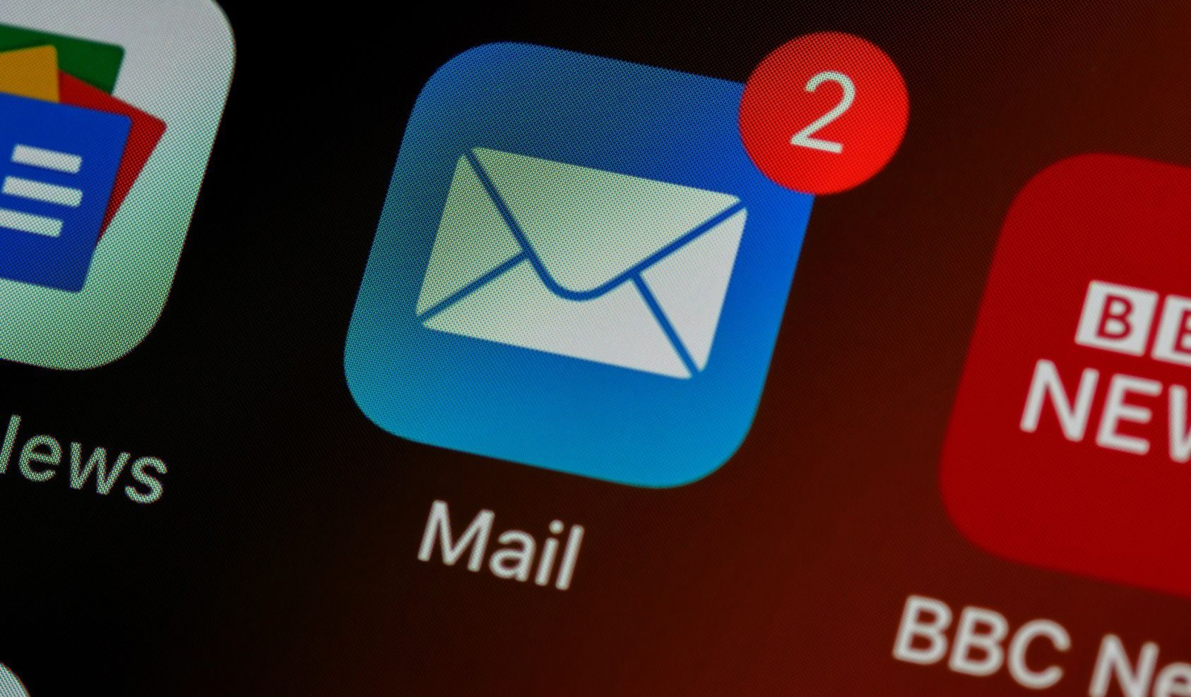 A phone screen shows a mail application with two notifications