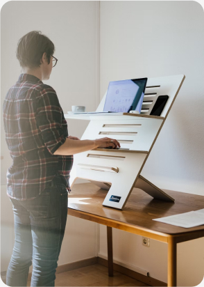 A person uses a standing desk
