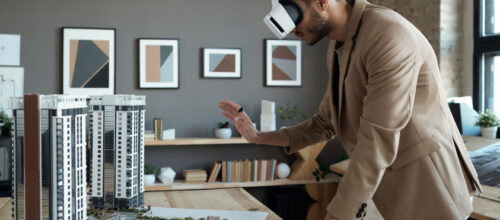 A man uses a VR headset to view an architectural design