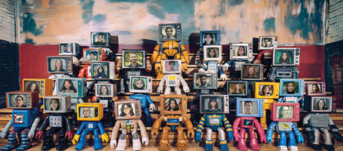 Group of toy-like robots with vintage TV heads showing the human and illustrated faces representing the students who took the inaugural Public Health 555 course, "ChatGPT/AI and Public Health," posed in tiered rows. This photo illustration served as a class picture for the course.