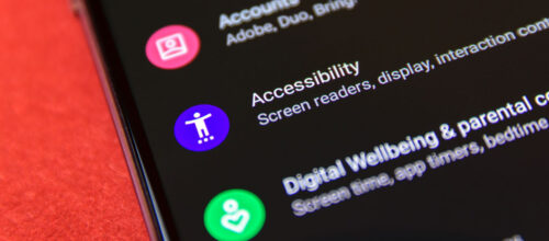 A smartphone screen displays the "Accessibility" settings option, including a purple icon and text mentioning screen readers and display settings.