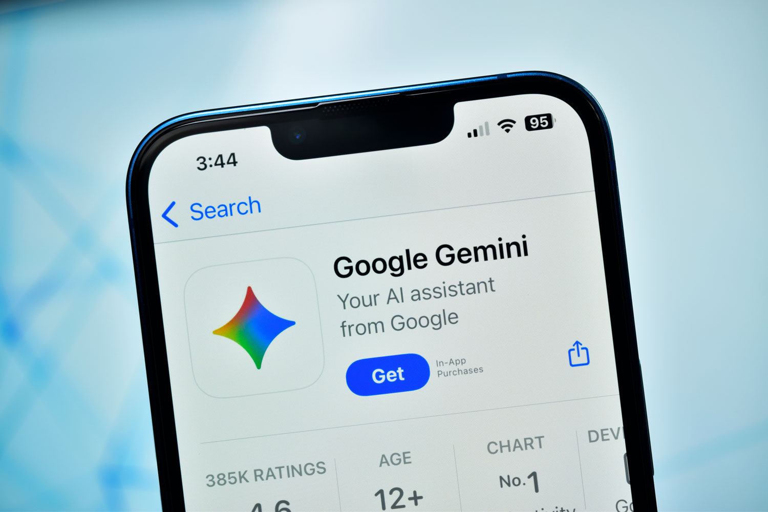 An iPhone displays the Google Gemini app page in the App Store with a blue "Get" button and the tagline, "Your AI assistant from Google."